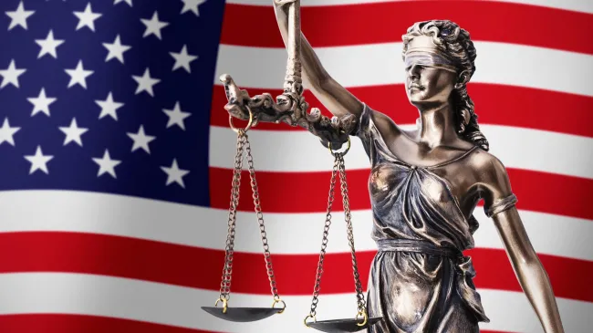lady justice and US flag